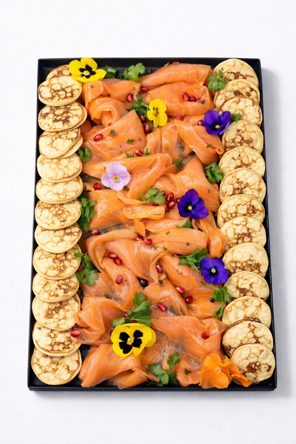 Smoked salmon platter with blinis