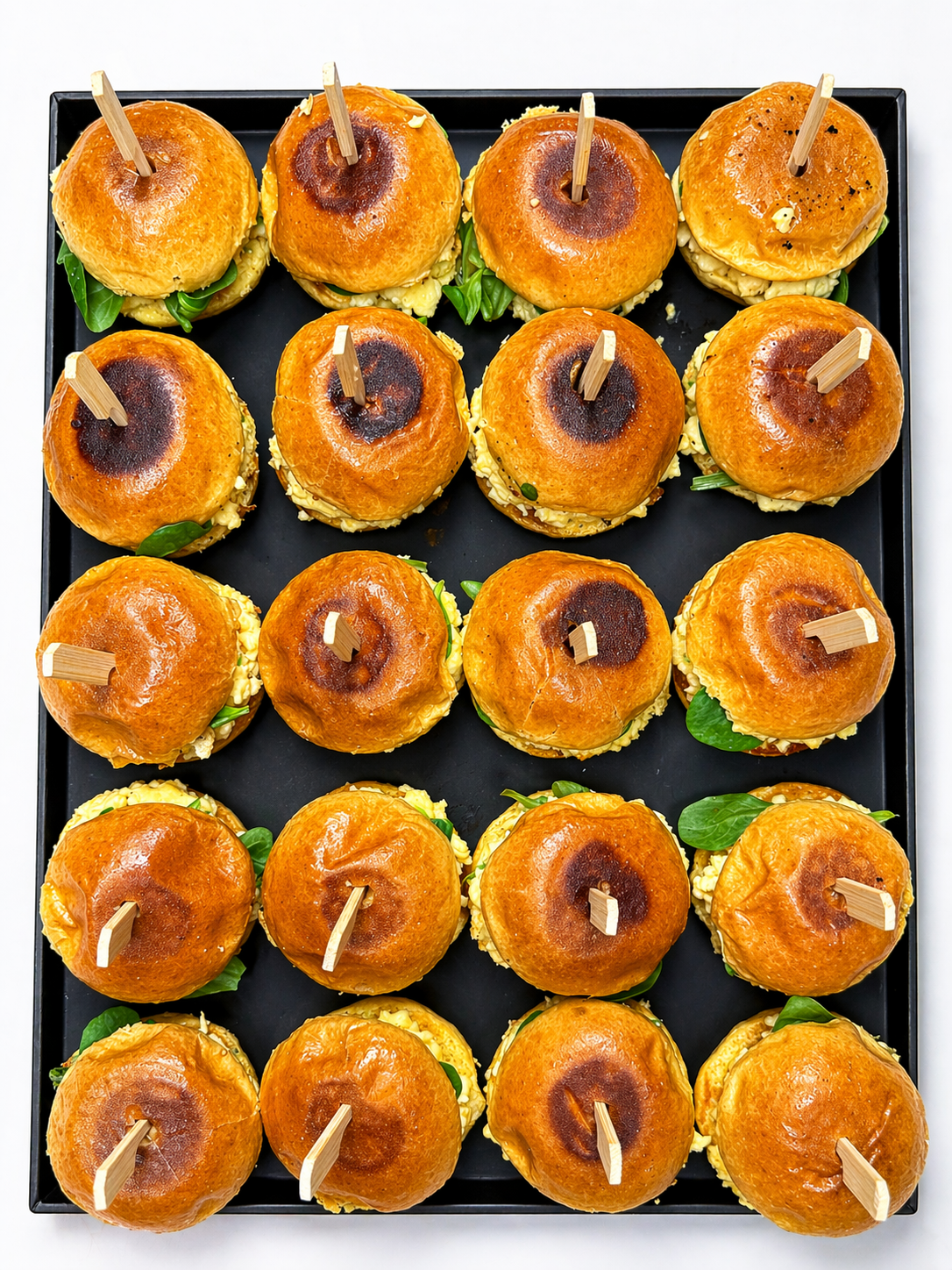 Gourmet mini bun platter with egg and spinach shoots